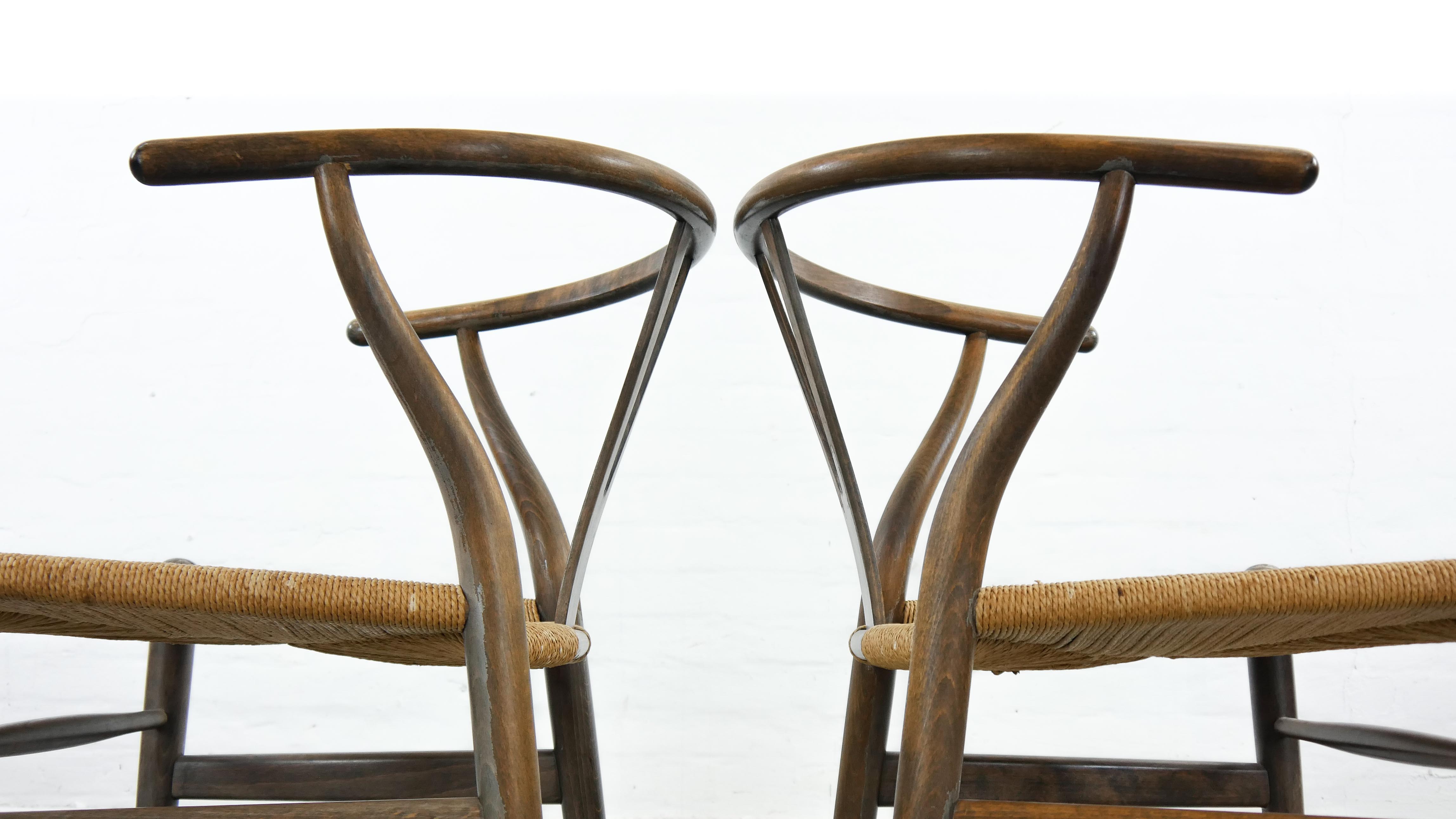 Pair of CH24 wishbone dining chairs by Hans Wegner for Carl Hansen Denmark