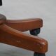 Dark green leather Chesterfield office chair on wheels.