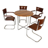 Table ronde et quatre chaises Bauhaus en acier tubulaire restaurées par M. Stam, années 1930