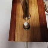 A set of wall lamps in teak wood, with amber colored glass