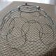 Fruit cut basket made of metal wire, ball feet