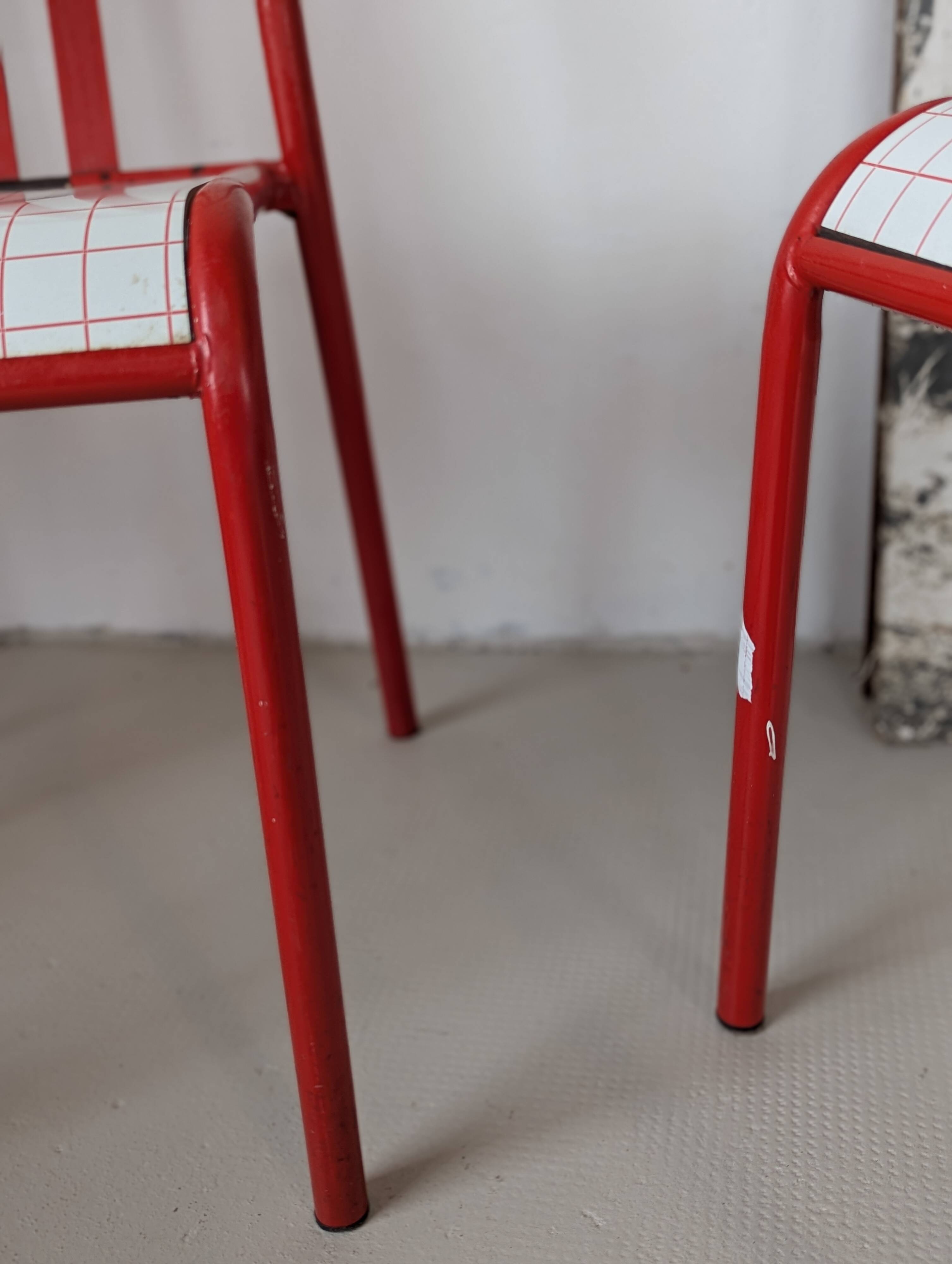 Set of 4 modernist red metal chairs