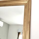 Large gold-framed mirror with bevelled glass.