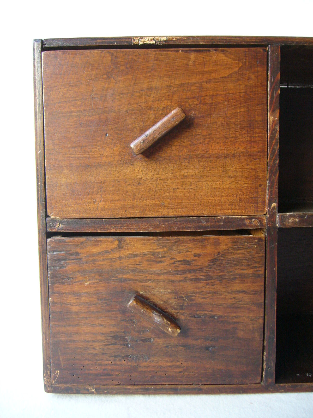 Antique, artisanal seven-drawer furniture