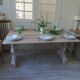 Console table in walnut with drop-leaf extensions, grey patinated base.