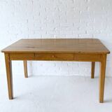 Wooden table with drawer