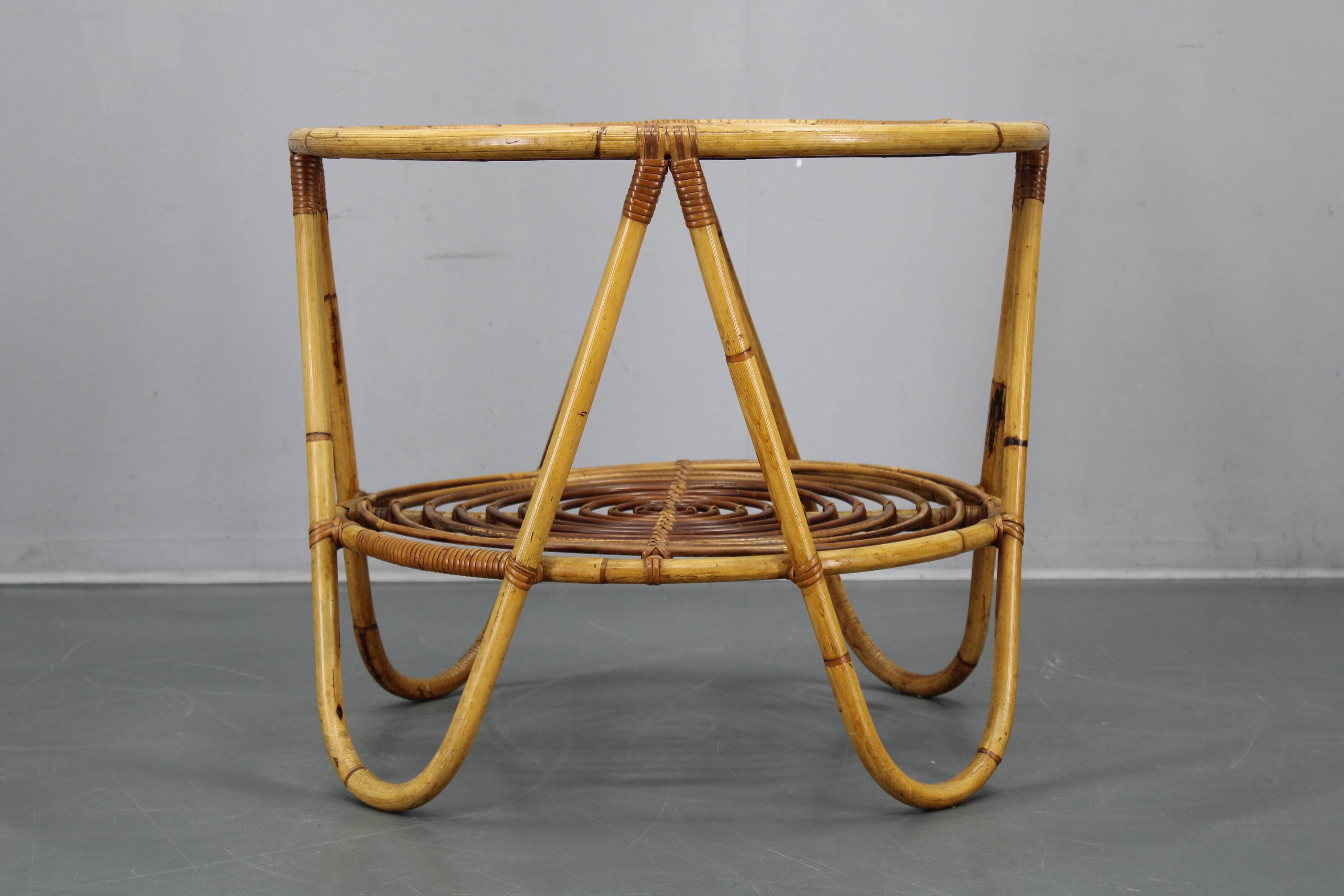 1960s Italian rattan coffee table with glass top, mid-century round design