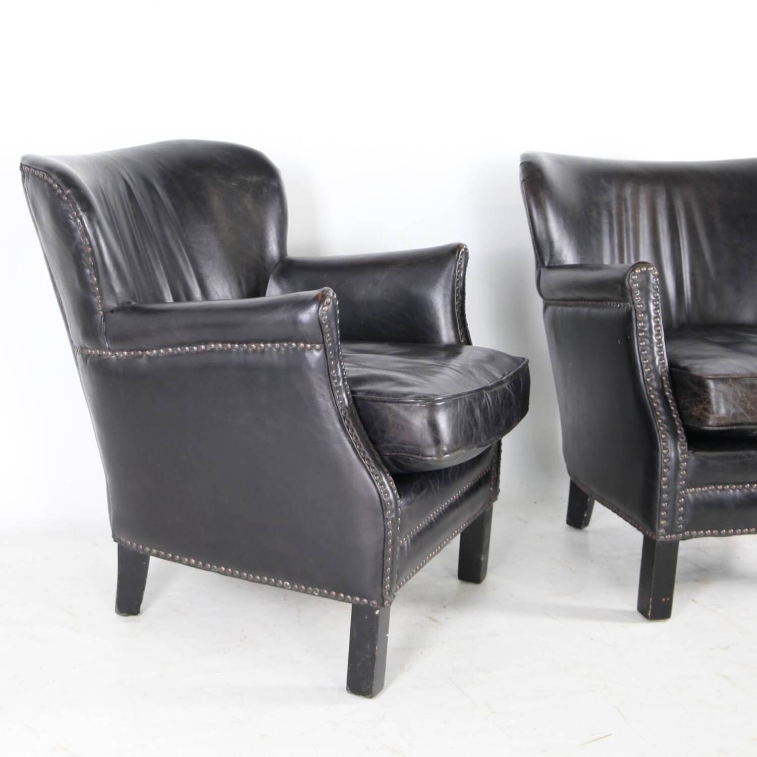 Pair of small leather club armchairs