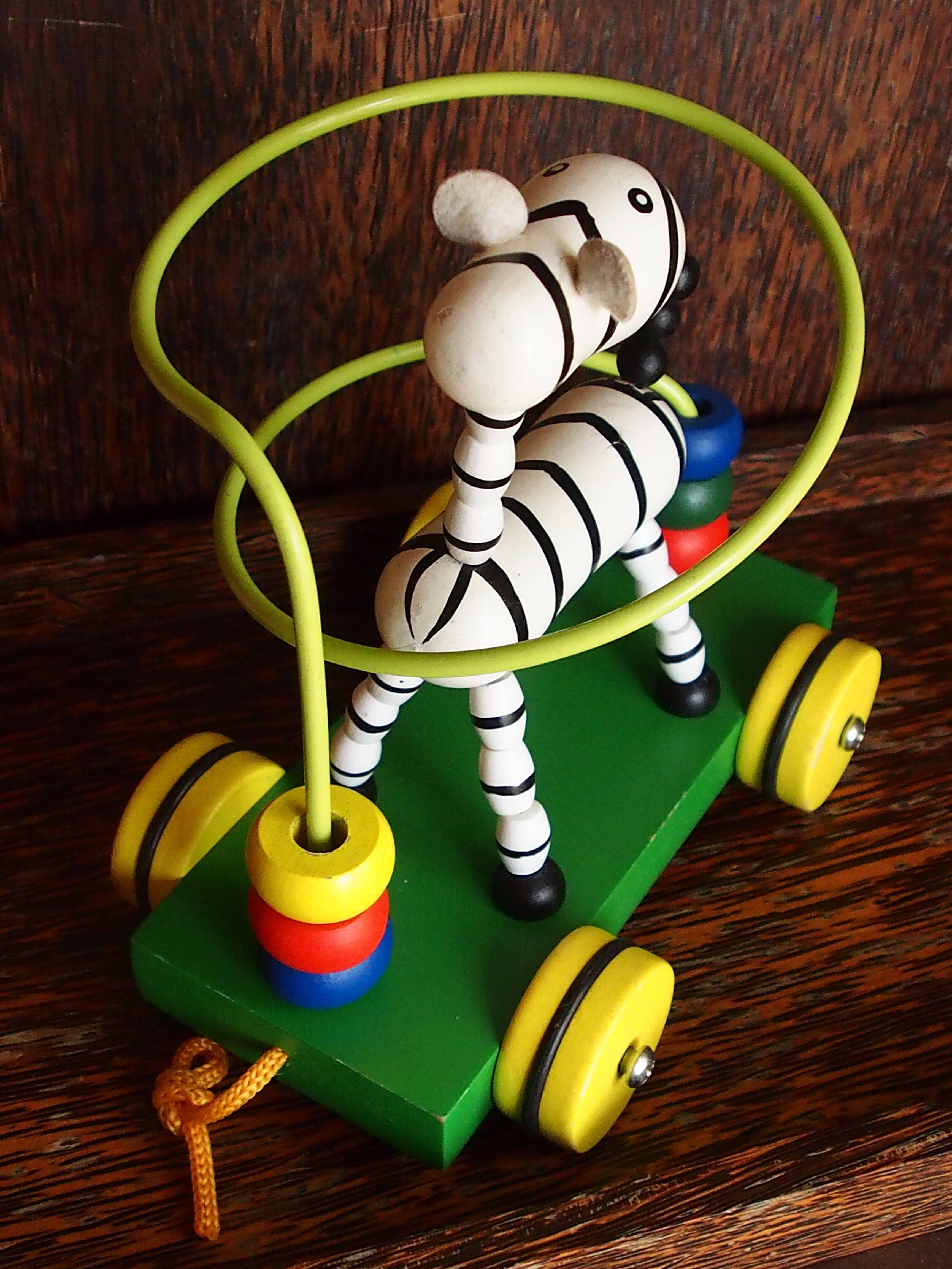 Old wooden toy, zebra car, to pull and push