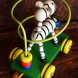 Old wooden toy, zebra car, to pull and push