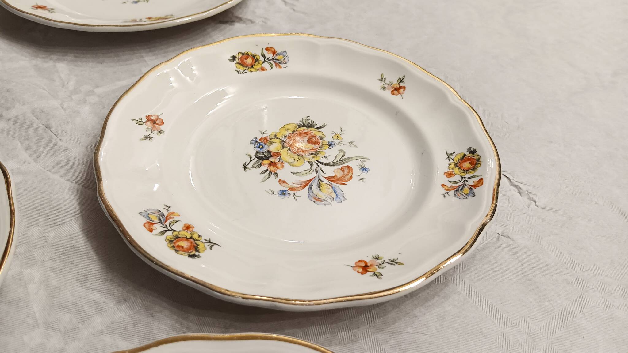 11 starter or dessert plates, KG Lunéville, Marie-Thérèse model - Yellow, blue floral patterns