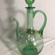 Old refreshing carafe pourer in green blown glass with vintage cap