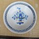 Old large round black ceramic dish