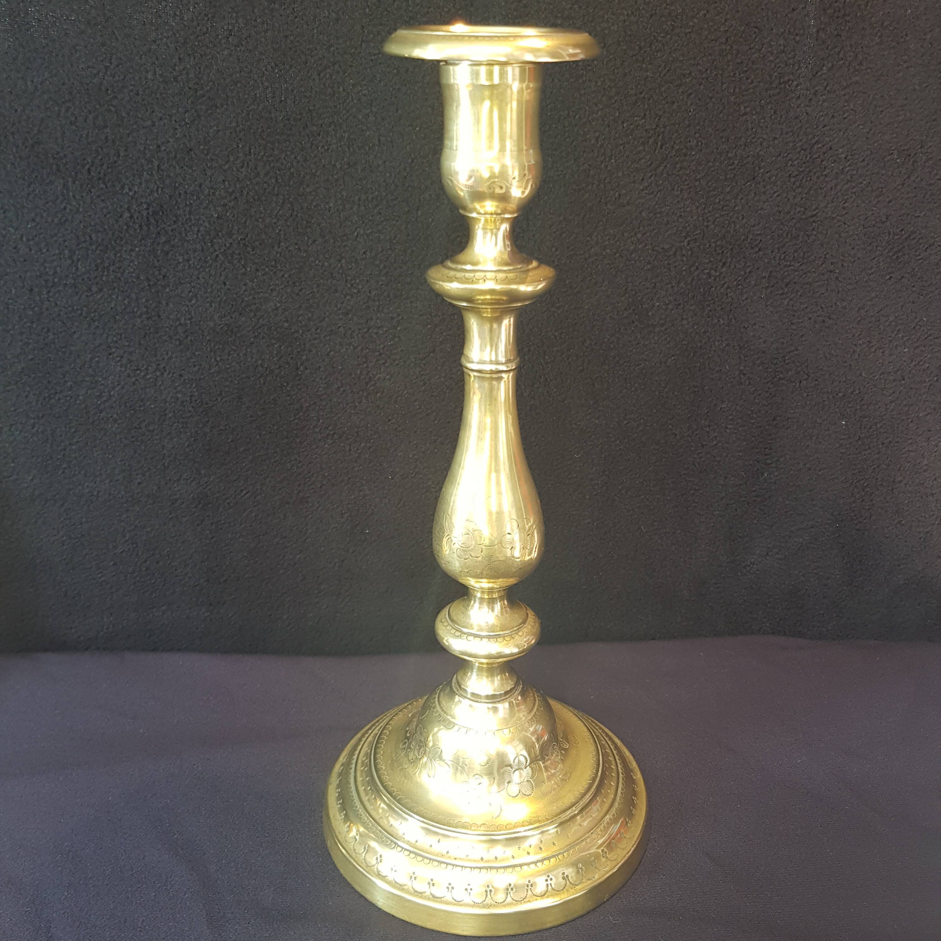 Chiseled gilded metal candlesticks