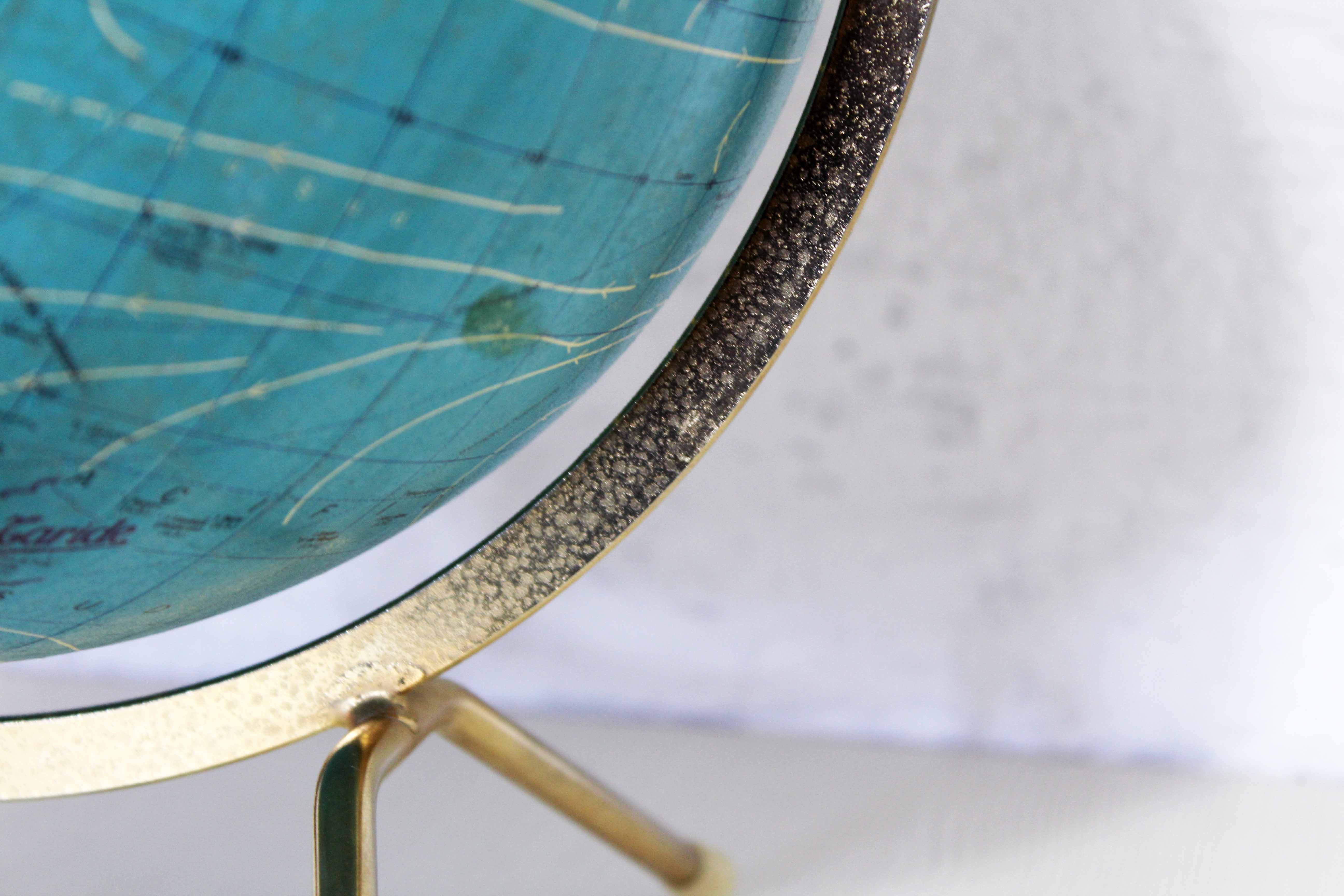 Luminous world map in tripod glass