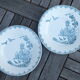 Duo of old plates in Iron Earth decorated with birds and butterflies
