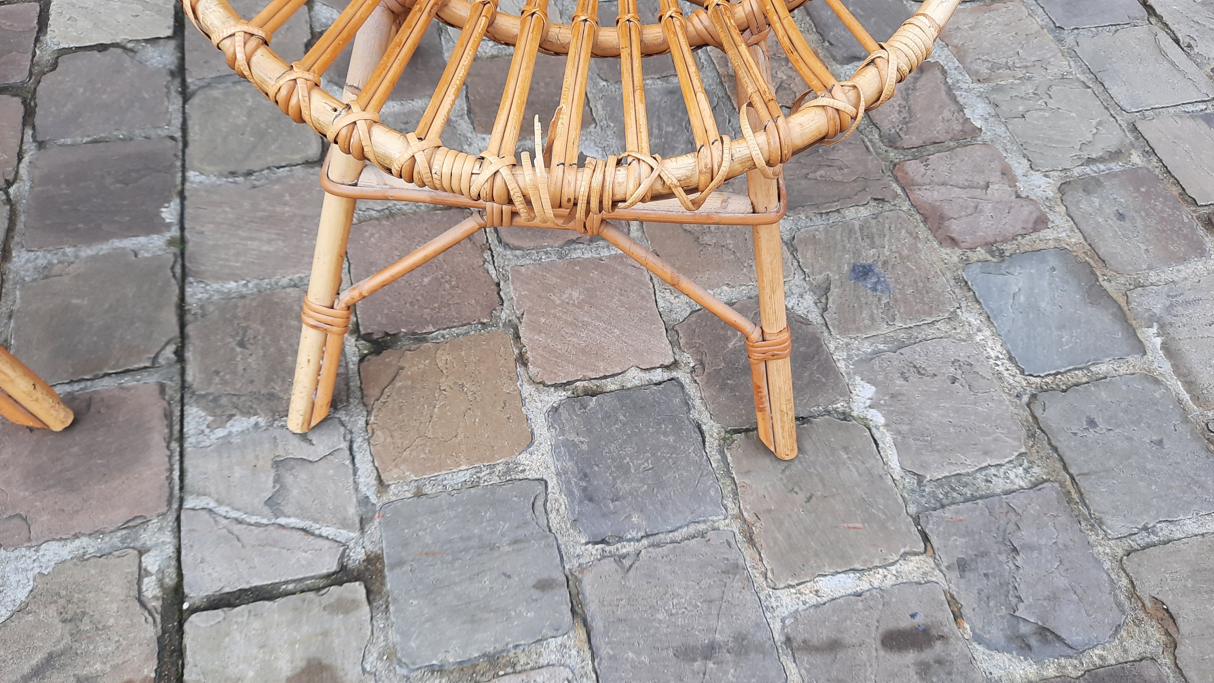 Pairs of shell rattan armchairs from the 50