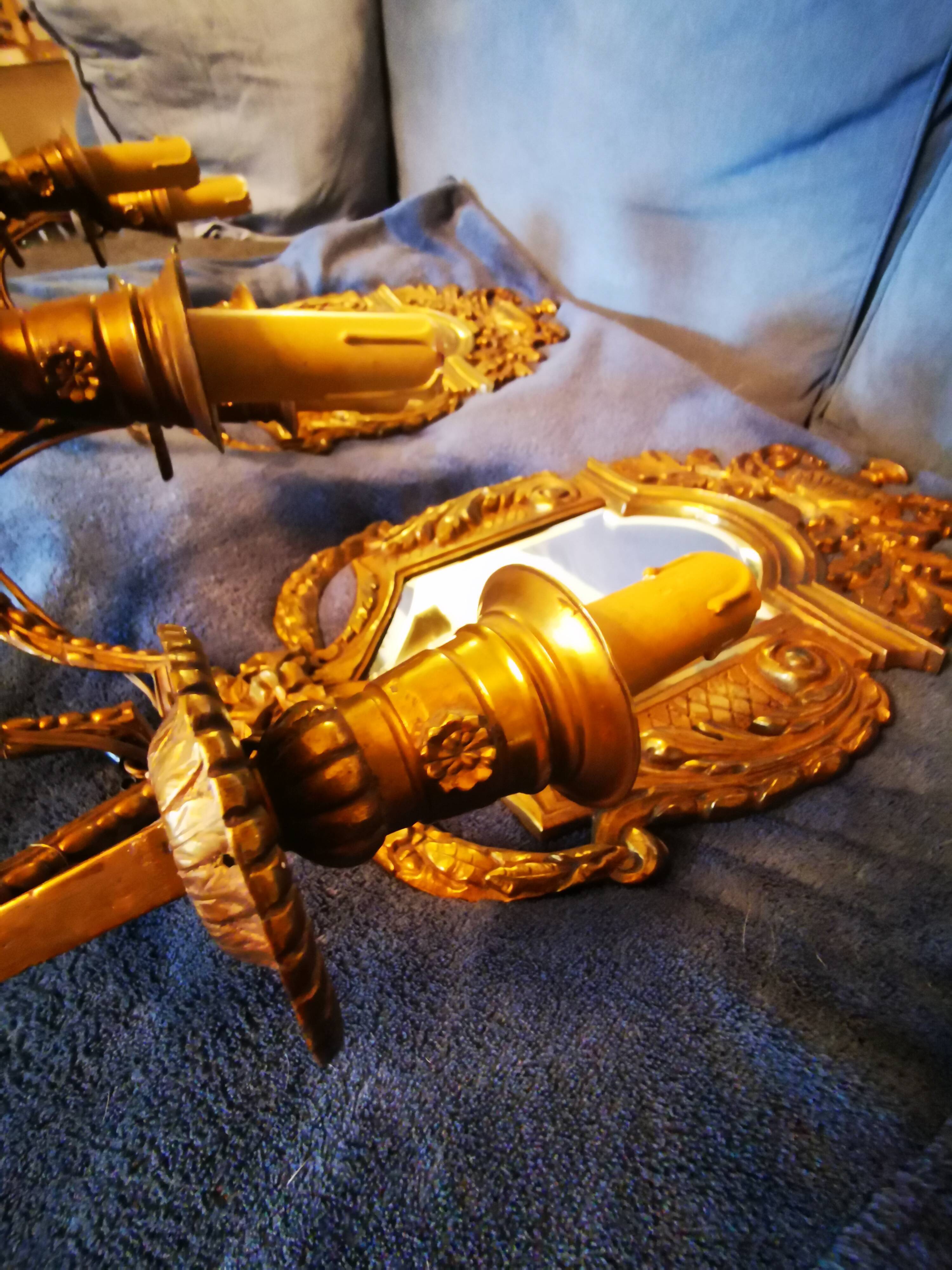 Pair of chissed and gilded bronze mirrors forming appliques