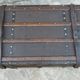 Old wooden and leather trunk, old brass nail trunk and leather strap