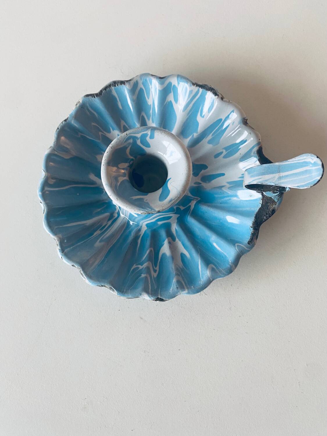 Old blue enameled metal candle holder