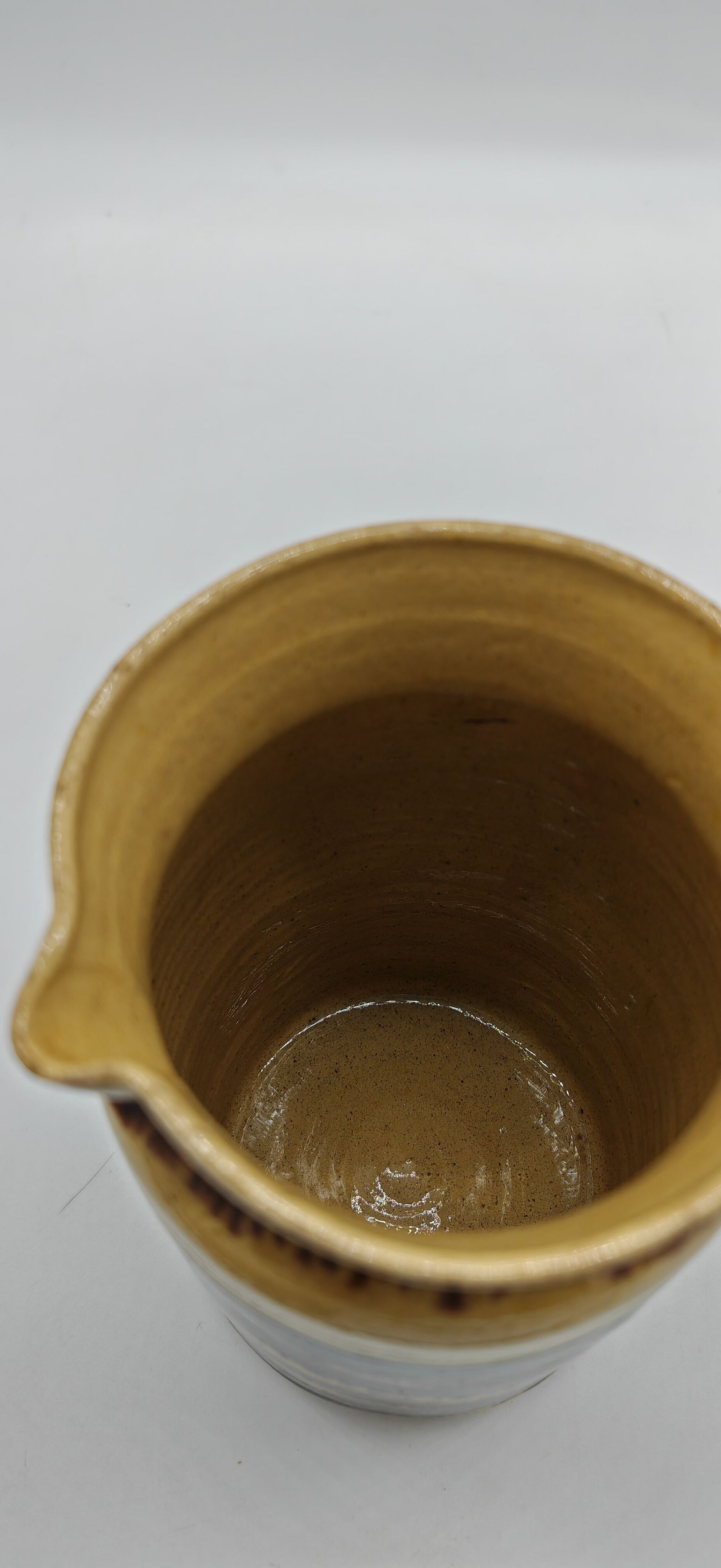 Pitcher covered in glazed earth old french tabby dishes