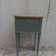 Bedside table, coffee table enhanced in smoky green, wooden top.