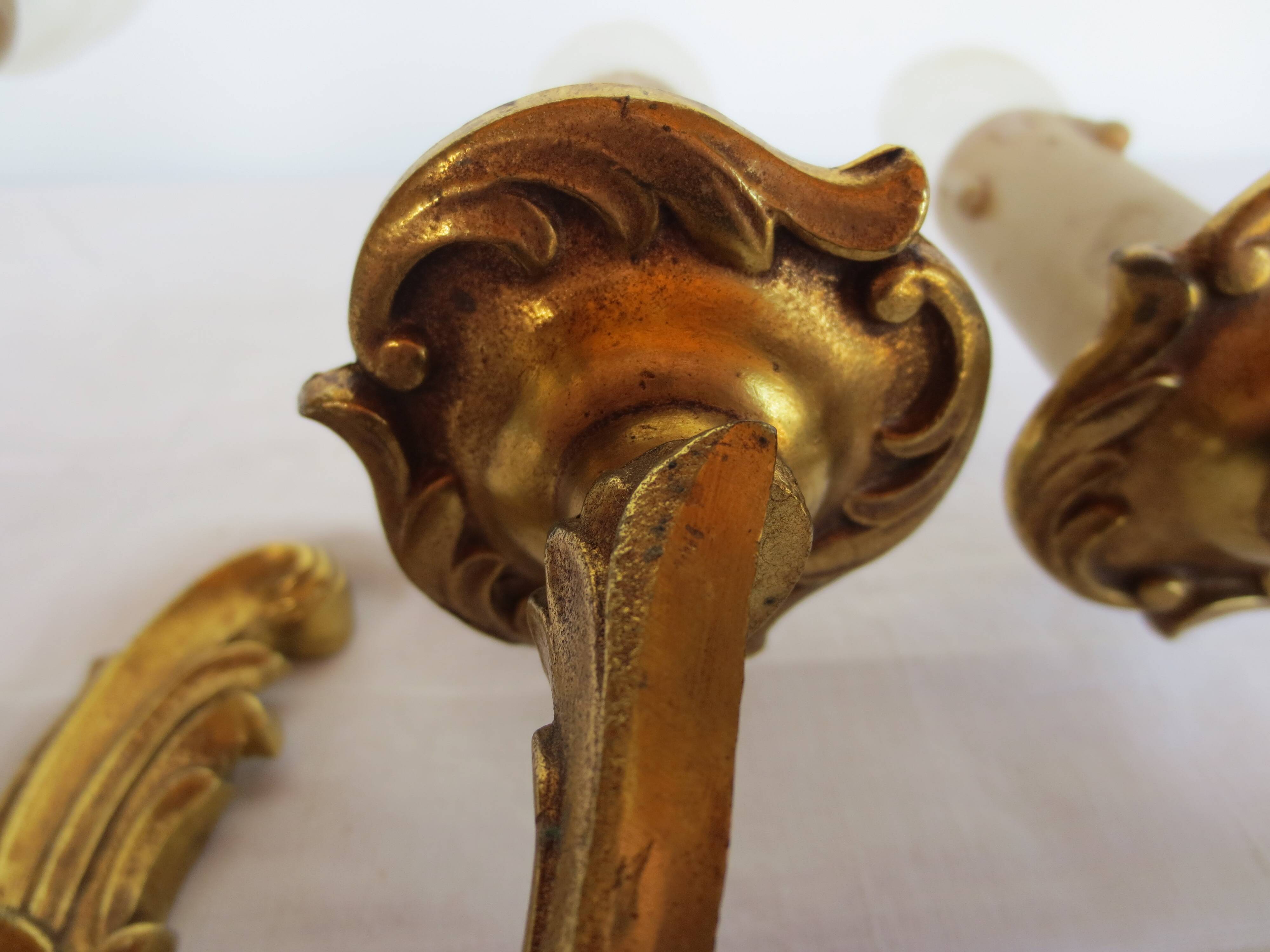 Pair of double wall lights in gilded bronze