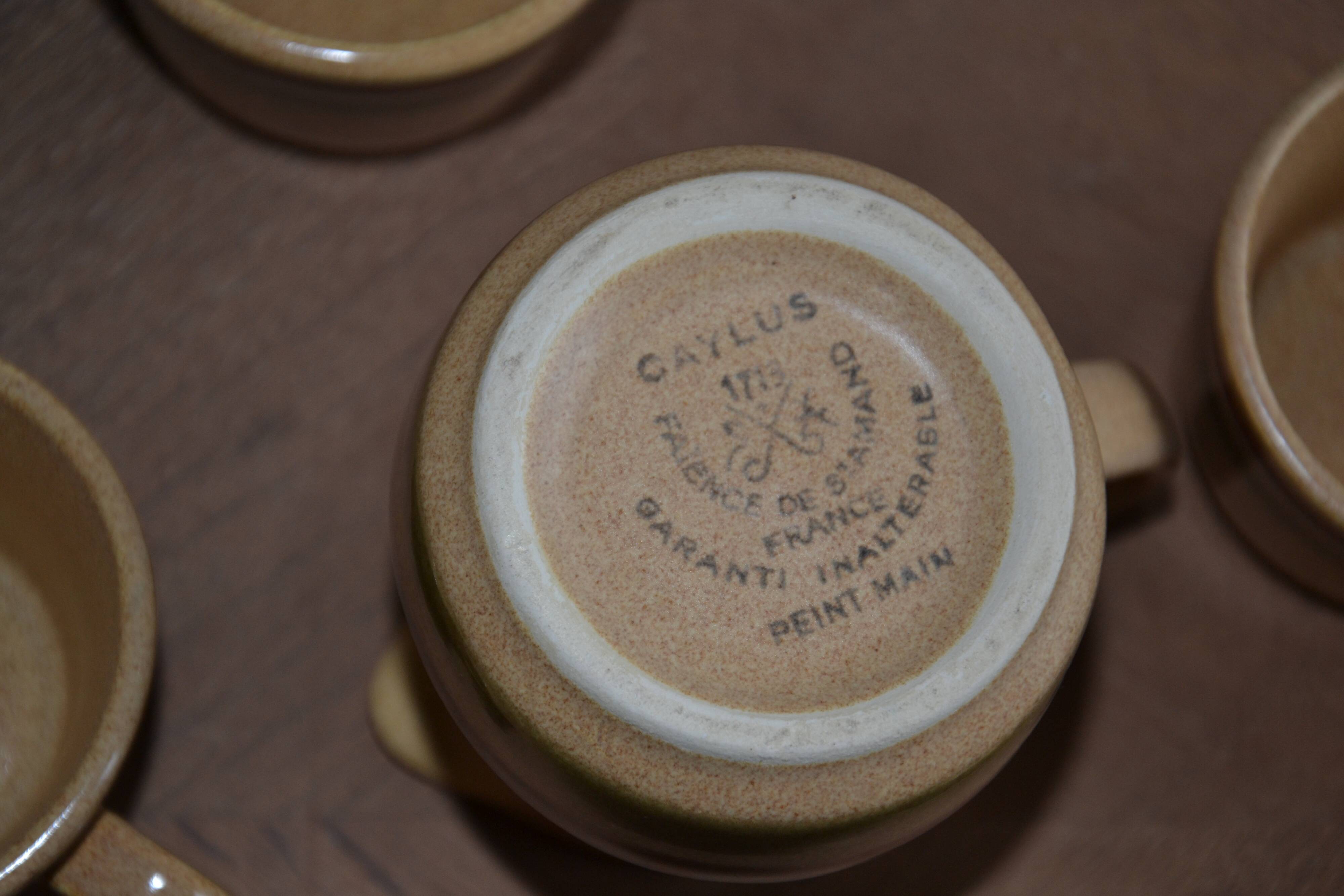 11 St Amand glazed stoneware cups and saucers/sugar bowl/milk jug