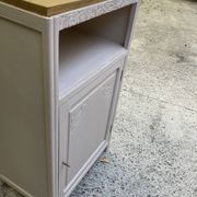 Beautiful art deco jam cupboard in delicate beige tone / and wicker basket