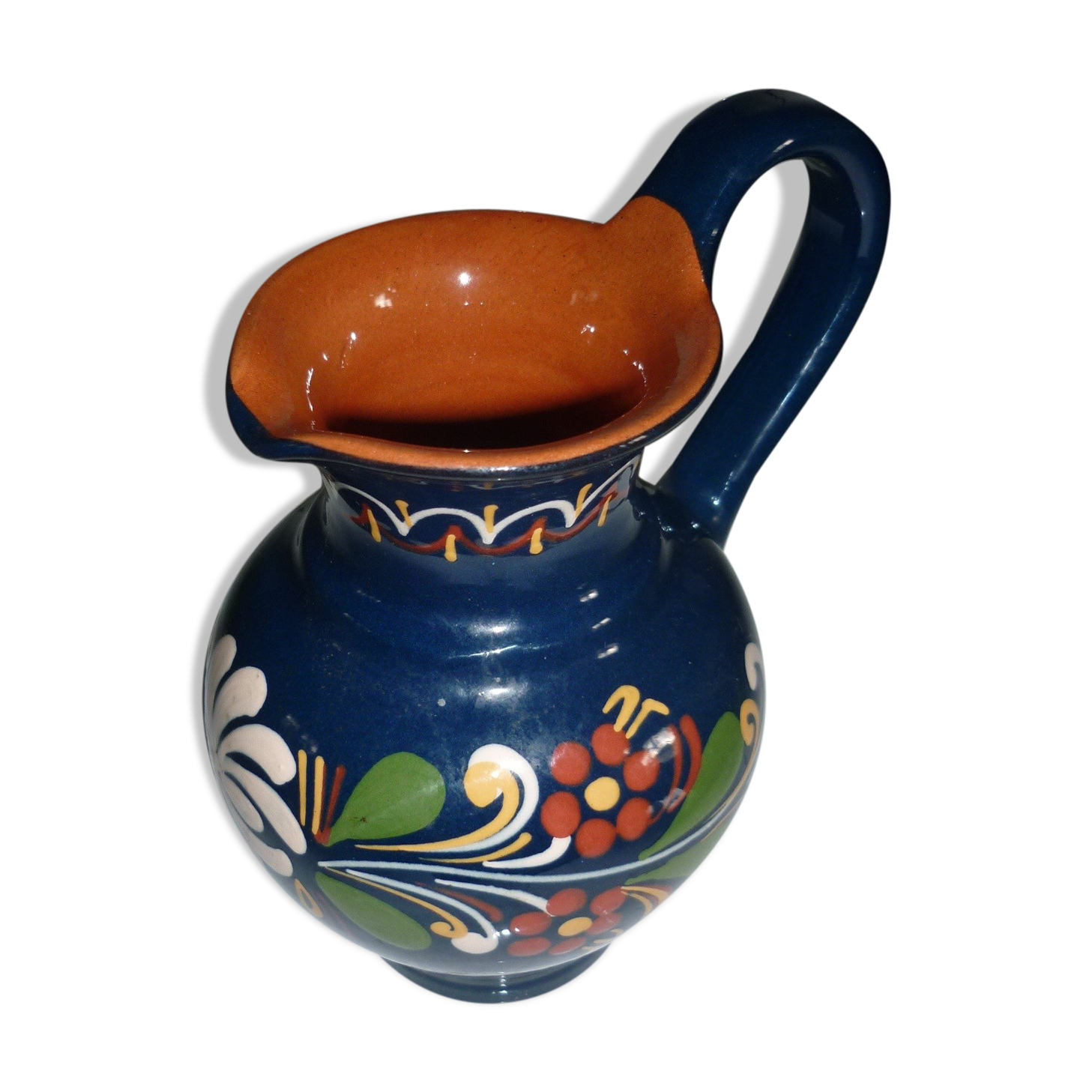 Blue glazed earth pitcher and flowers