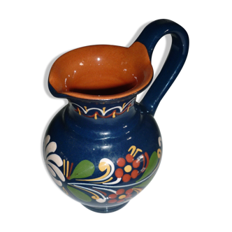 Blue glazed earth pitcher and flowers