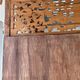 Very large freestanding teak mirror with an openwork carved pediment, Indonesia.