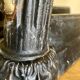 Pair of antique fire dogs with lion heads - patinated cast iron