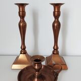 Set of a pair of candle holders and a hand candle holder