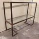 1970s console, minimalist design, burnished brass and glass, Mid-Century style.