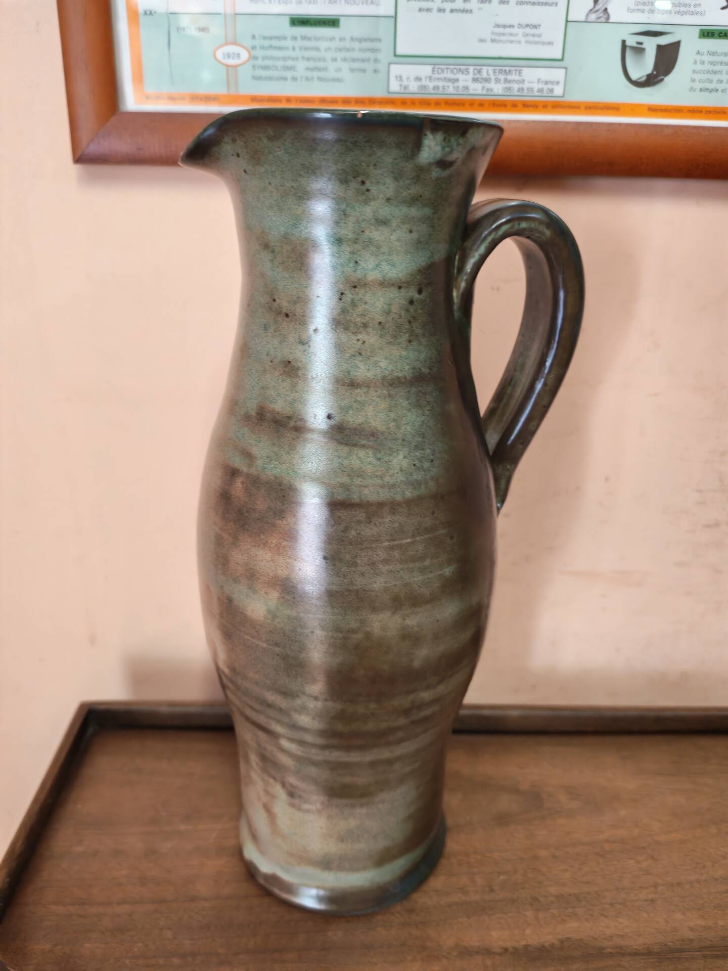Set of three vintage ceramic jugs and a pitcher.