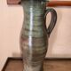 Set of three vintage ceramic jugs and a pitcher.