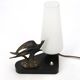 Art Deco lamp with swallow sculpture, marble base, opaque white globe.