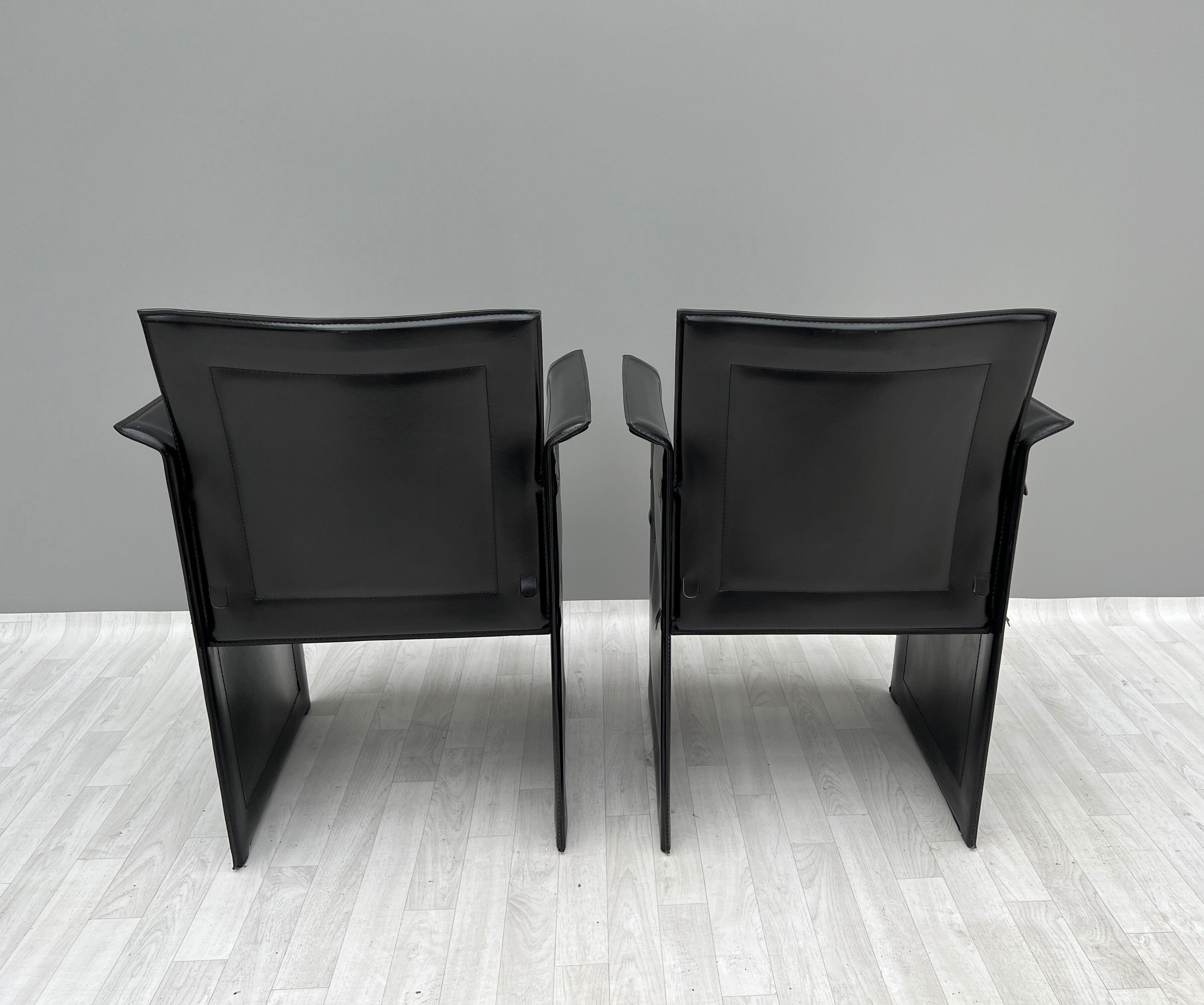Pair of armchairs in black leather