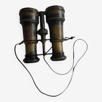 Old brass binoculars with integrated compass