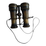 Old brass binoculars with integrated compass