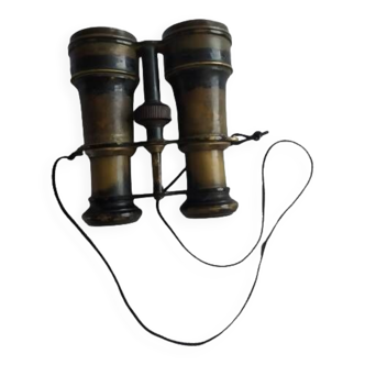 Old brass binoculars with integrated compass