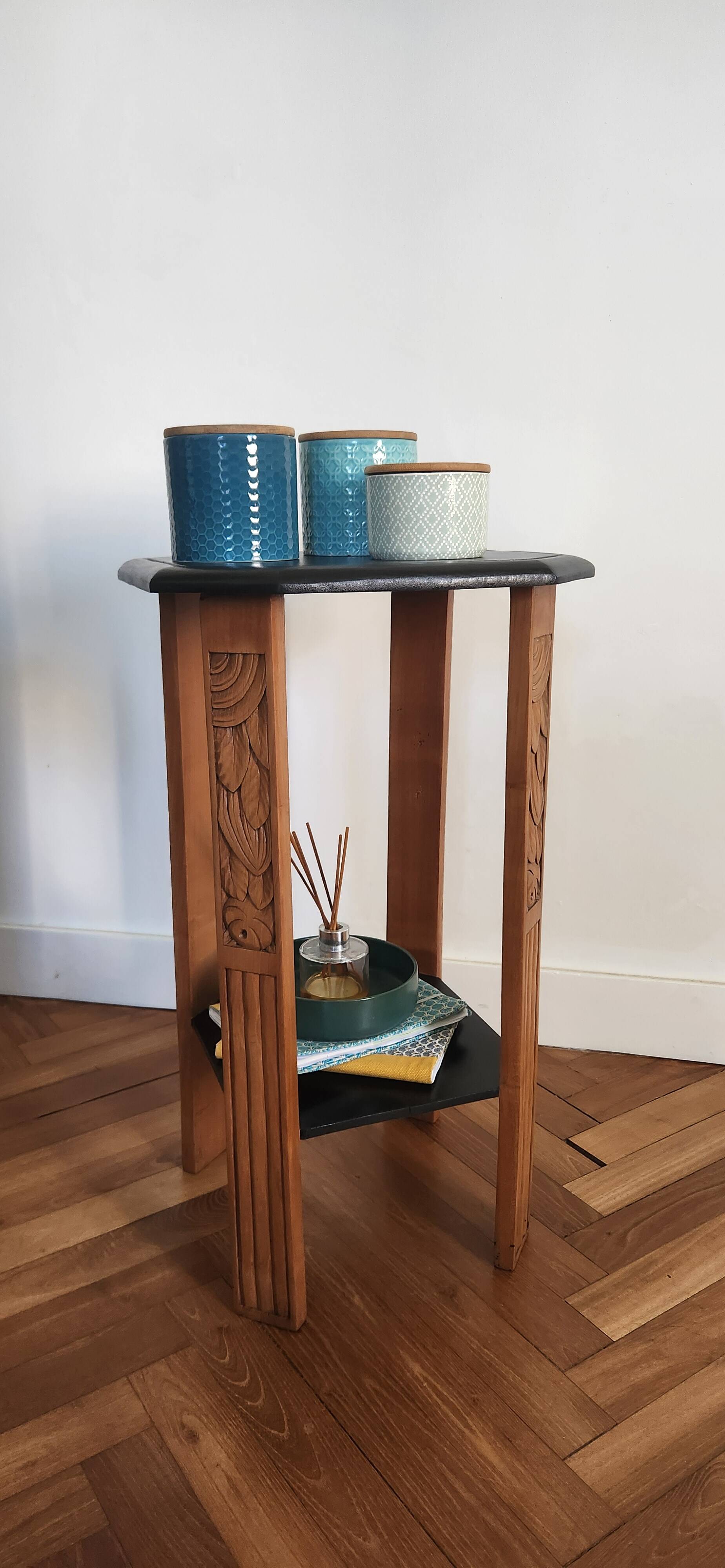 Art Deco console with sculpted black lacquered legs.