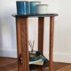 Art Deco console with sculpted black lacquered legs.