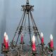 Wrought chandelier in Gothic style.