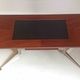 Vintage coffee table from the 1950s in mahogany and metal, with a tabletop width of 110 cm.