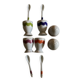 Set of 4 egg cups with their spoons, salt shaker, colored pepper shaker