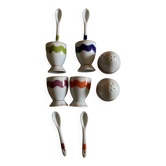 Set of 4 egg cups with their spoons, salt shaker, colored pepper shaker