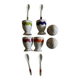 Set of 4 egg cups with their spoons, salt shaker, colored pepper shaker
