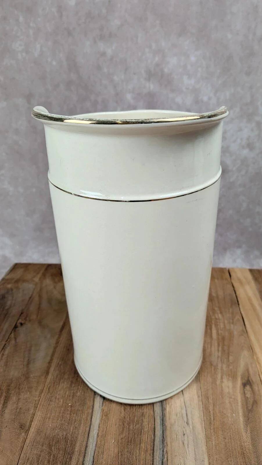 Large antique jug from Sarreguemines with golden trim.